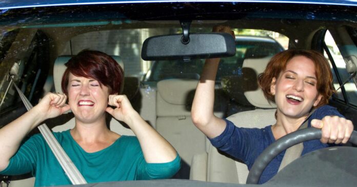 1_One-woman-singing-and-one-woman-covering-her-ears-in-a-car.jpg